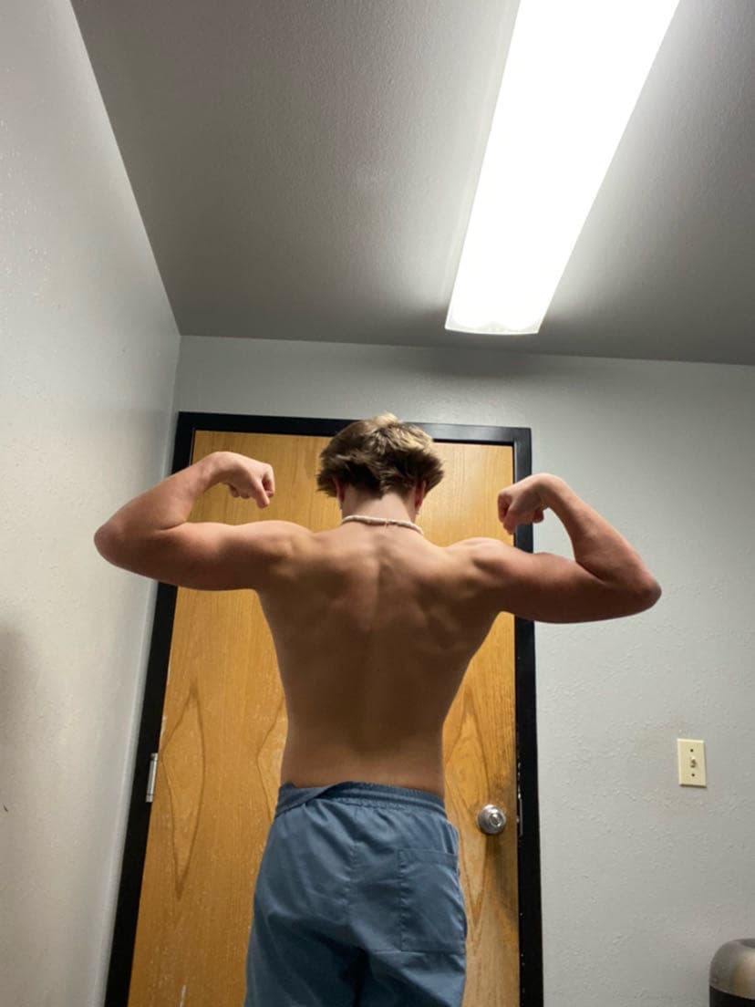 Carter Harrison, mid-journey — back physique photo